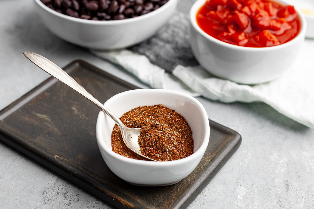 preparing seasoning mix for plant based bean bowl