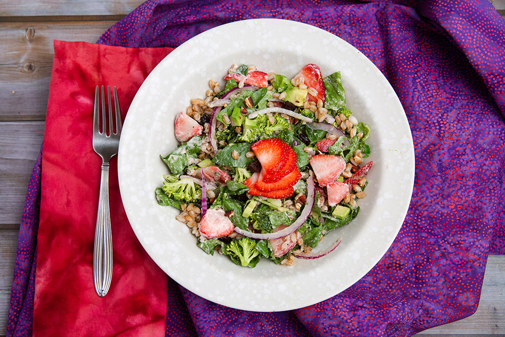 strawberry broccoli bowl with lemony poppy seed dressing oil free