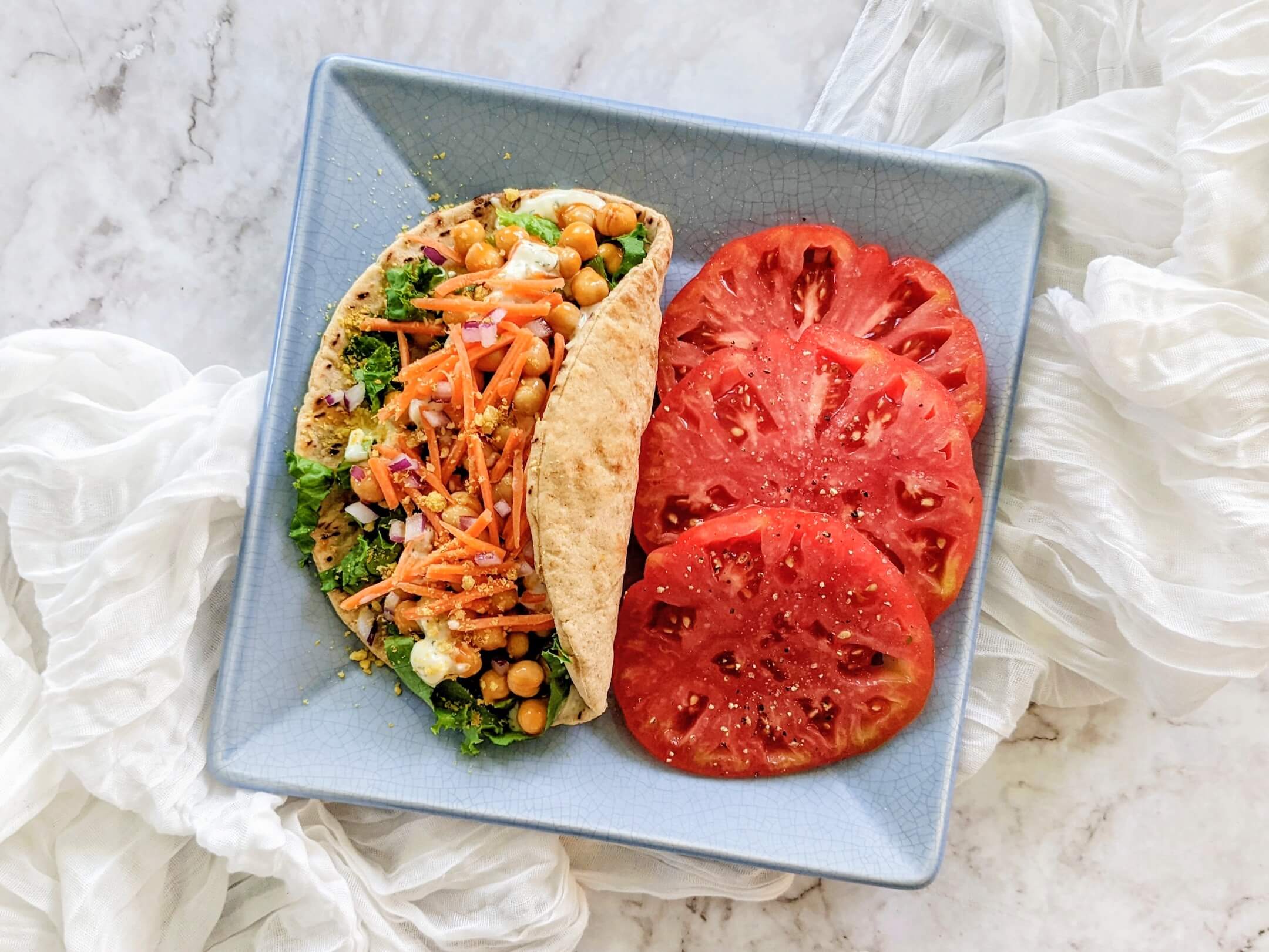 Buffalo Chickpea Plant Based Blue Cheese Gyro and Heirloom Tomato Slices