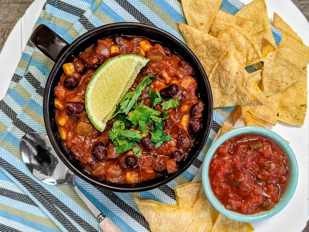 butternut and black bean chili and baked tortilla chips and salsa