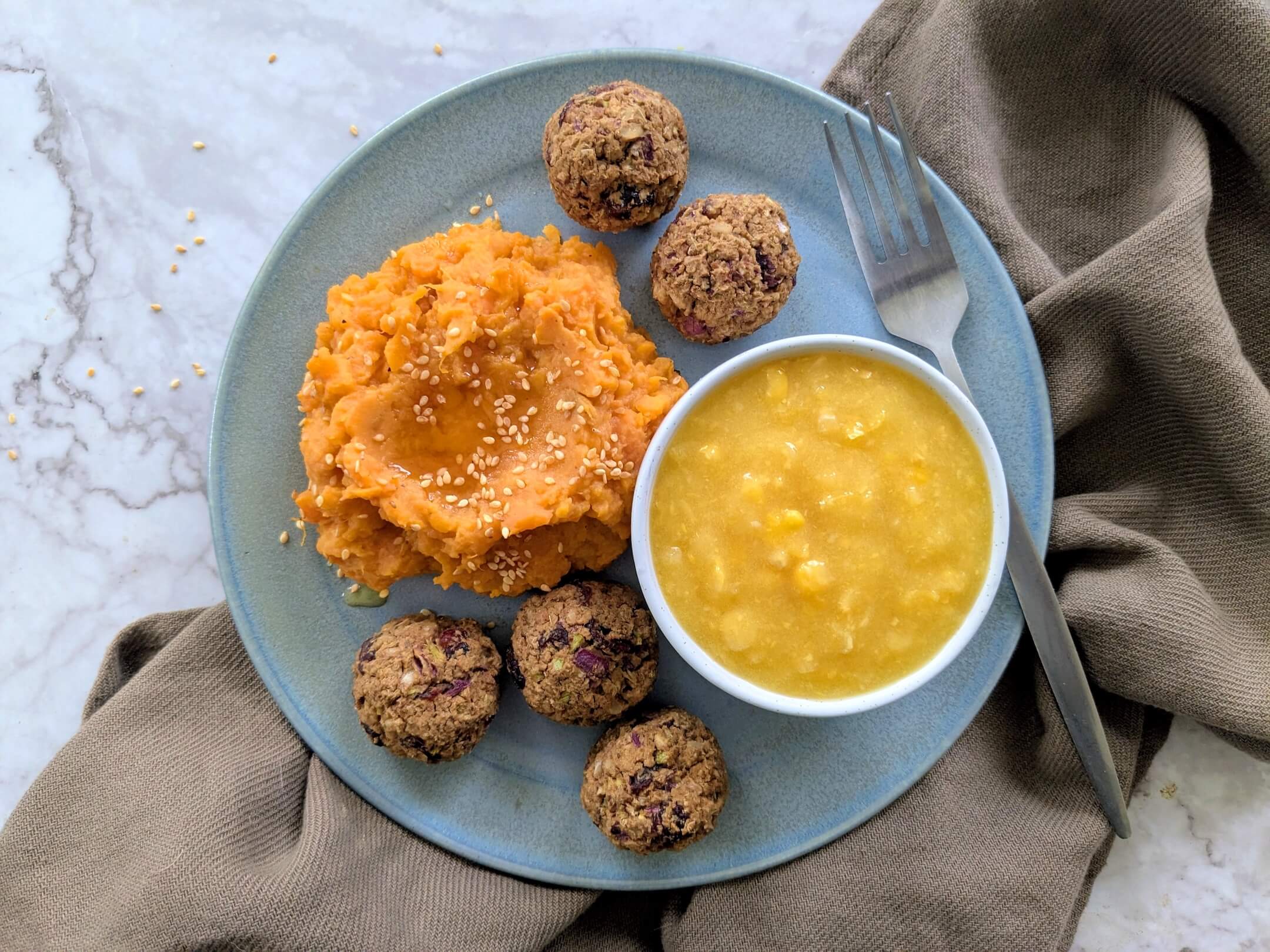 Cranberry stuffing meatballs, maple mashed sweet potatoes and steamed corn