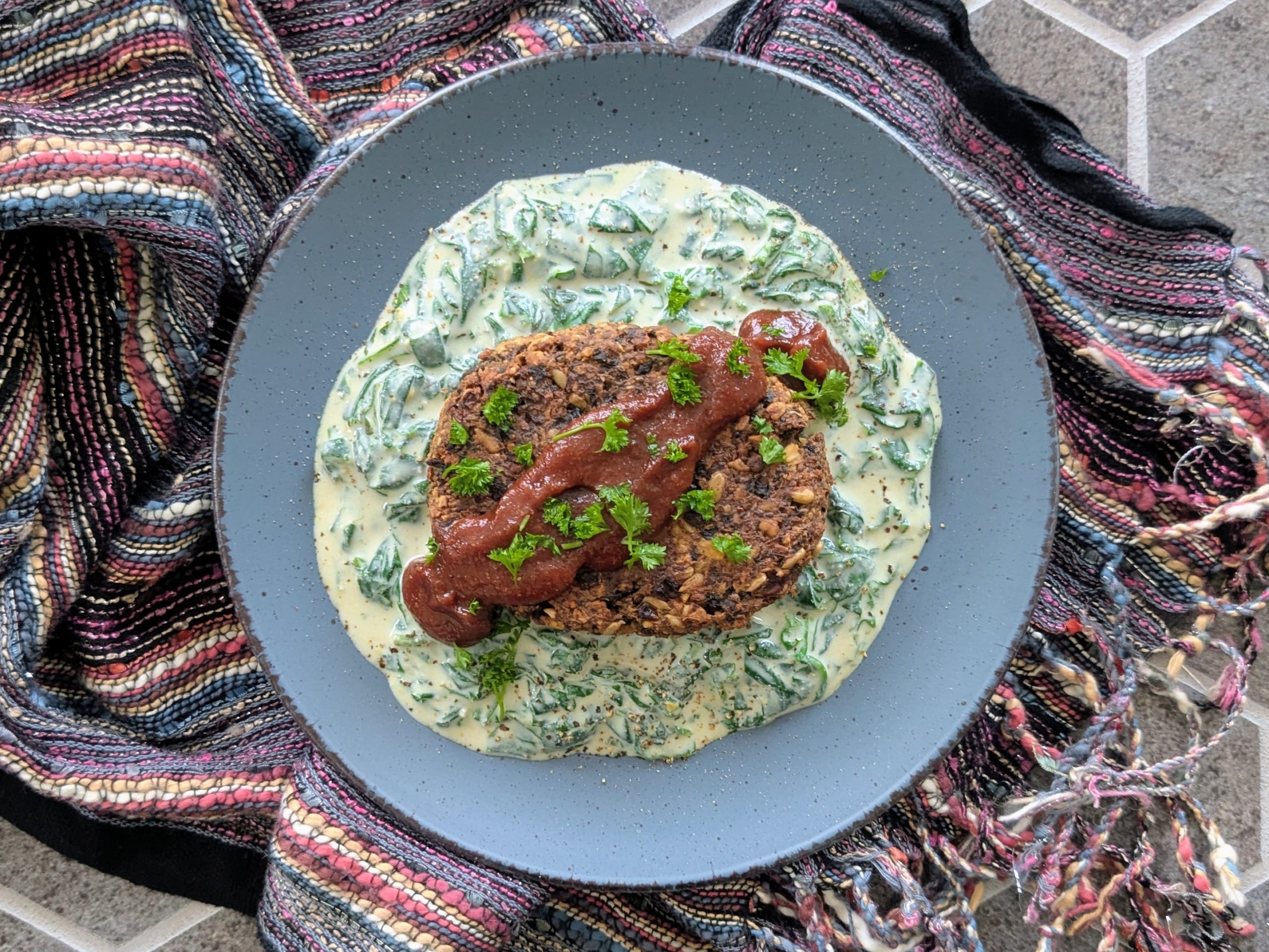 Hamburger Steak over Creamy Spinach with Steak Sauce
