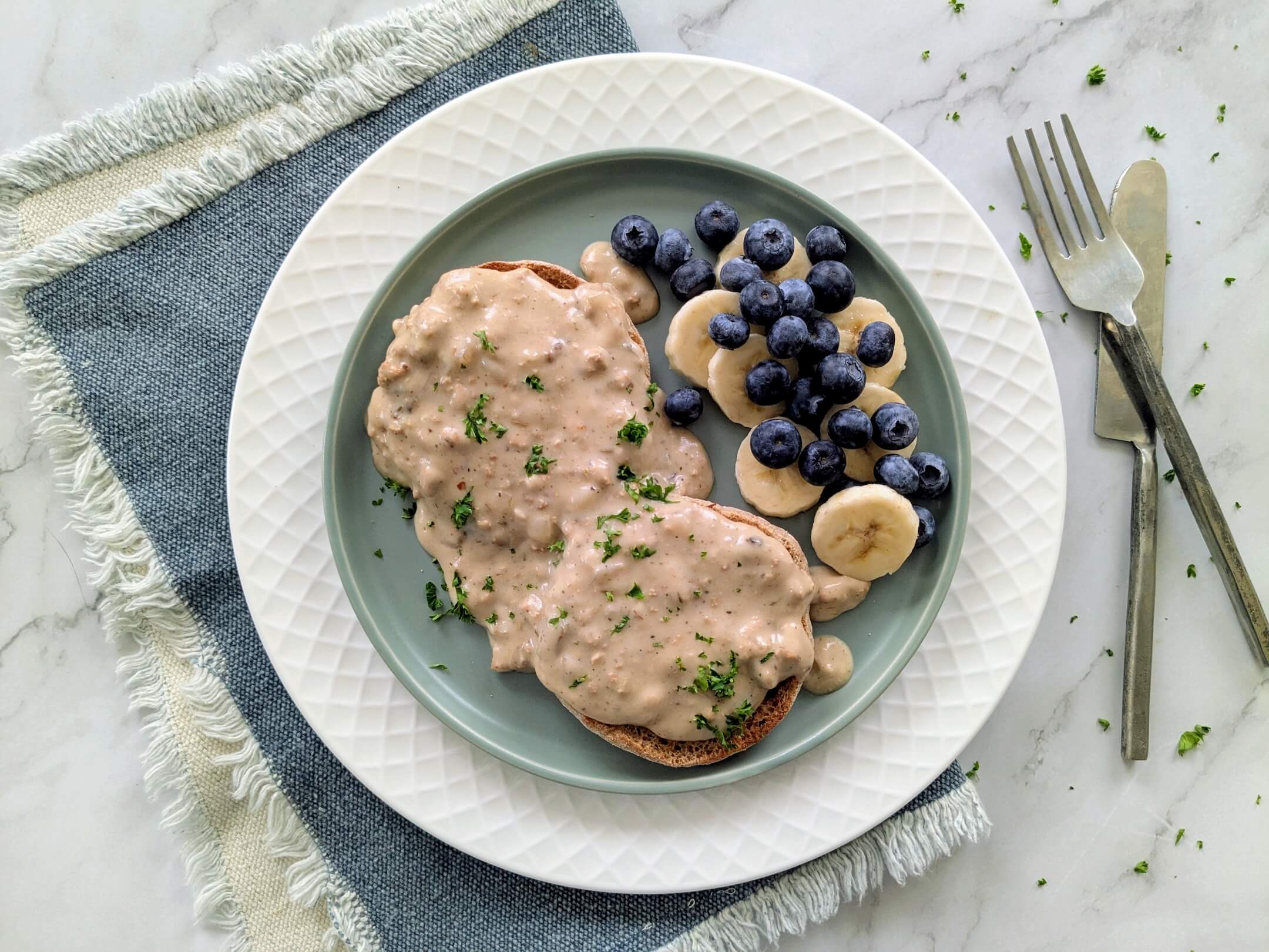 Plant based Tofu Sausage Gravy over English Muffins and Fresh Fruit