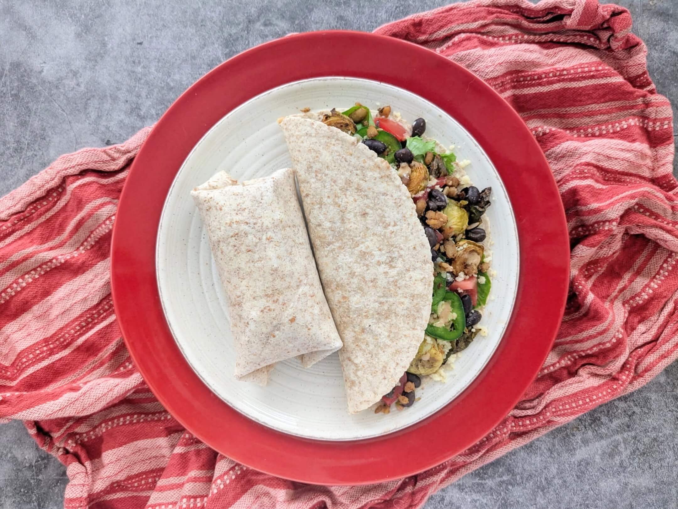 Black bean & tempeh wraps with creamy lemon herb sauce