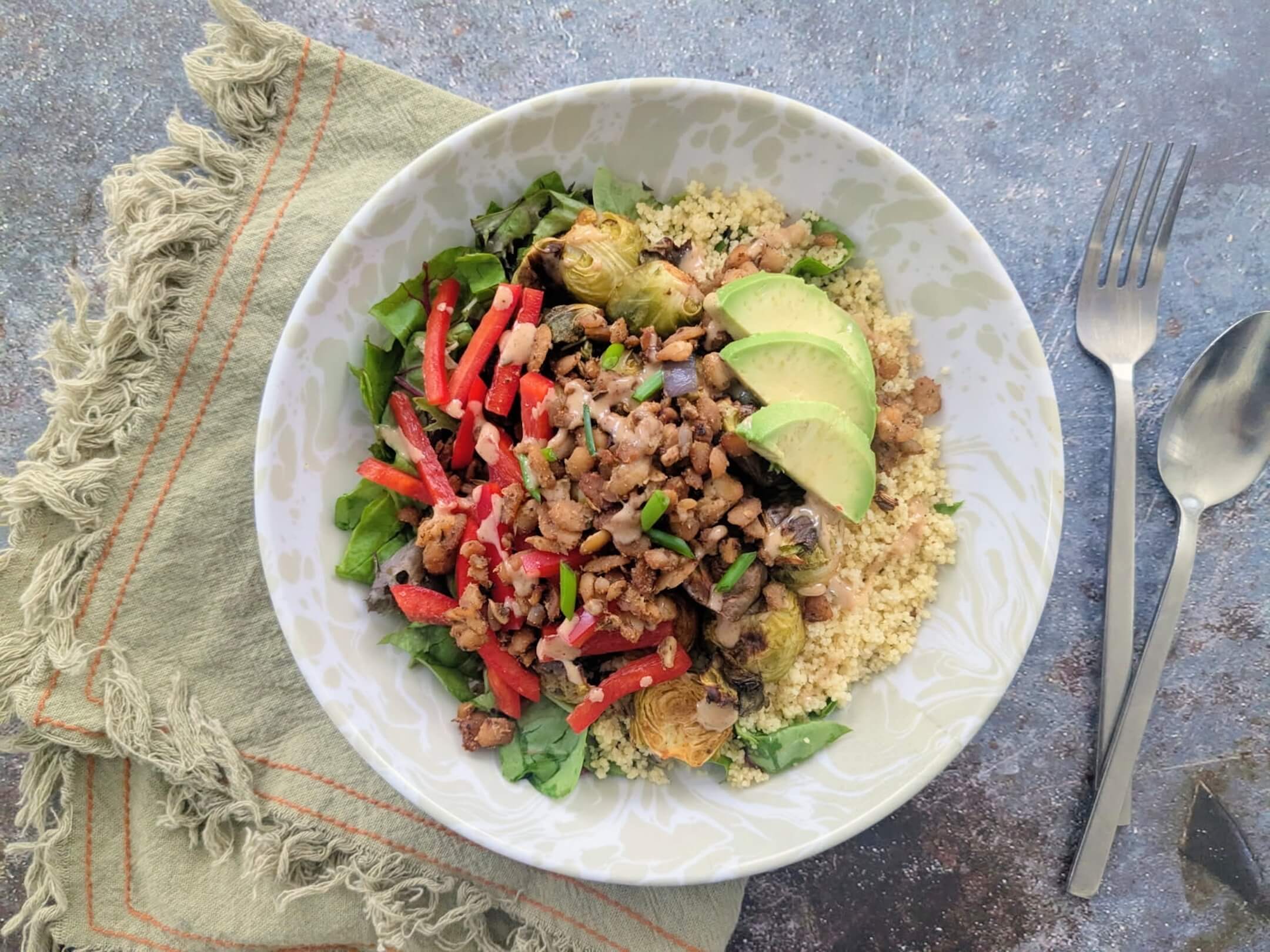Bomb-Ass Roasted Brussels Bowl with Sunny Spiced Cilantro Cream Sauce,