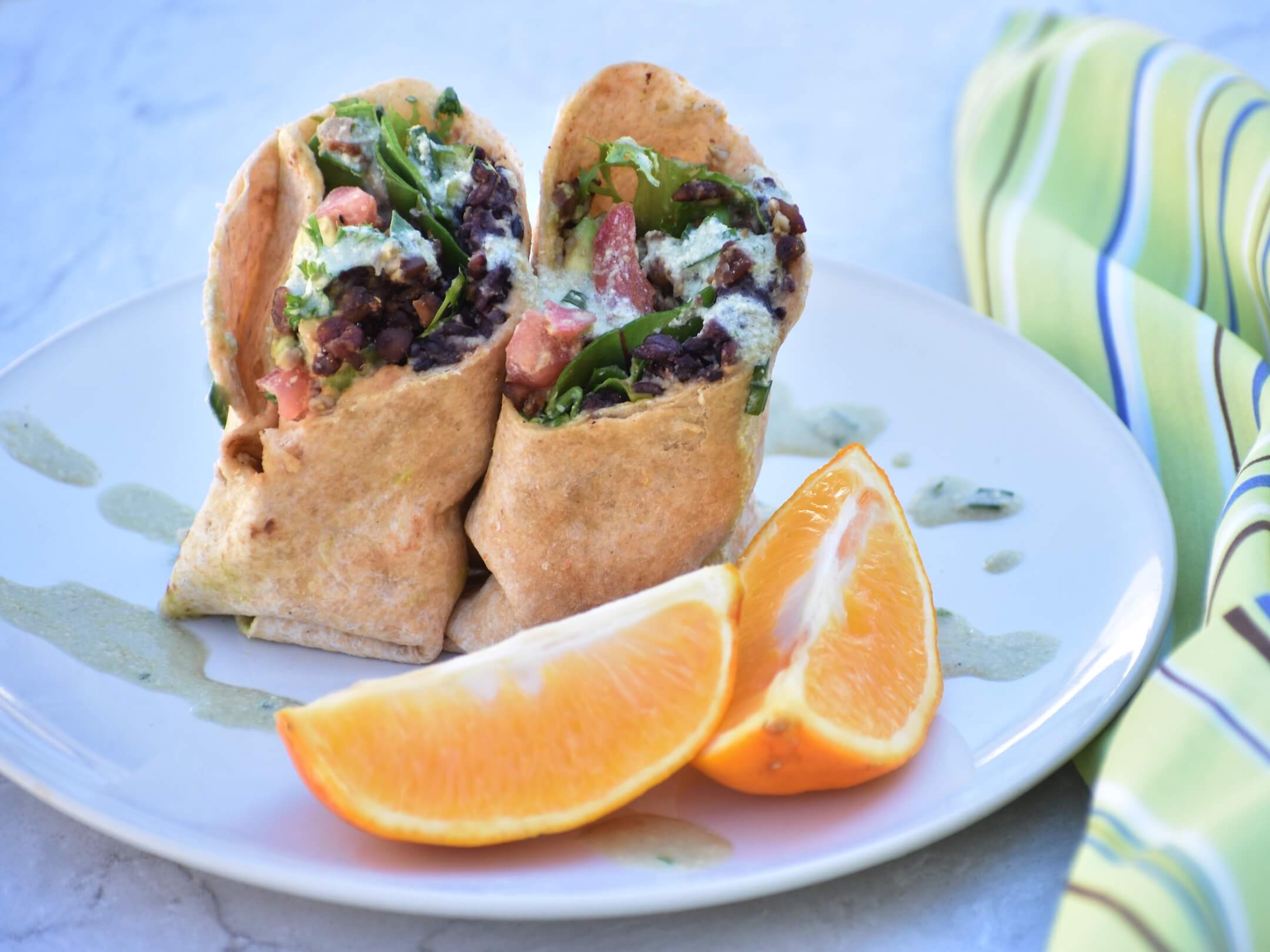 Smoky Tempeh, Lettuce & Tomato Wraps with Orange Wedges