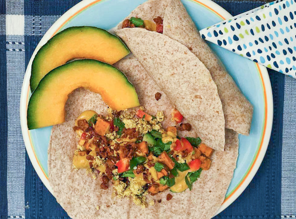Savory Breakfast Burritos with Smoky Gouda Sauce and Melon Slices